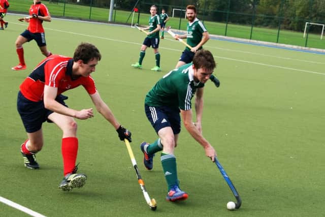 Nick Sharp (right, green shirt) in action for Brigg at Brumby Hall against Sheffield Hallam EMN-161031-095440002