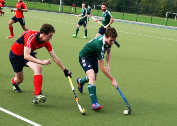 Nick Sharp (right, green shirt) in action for Brigg at Brumby Hall against Sheffield Hallam EMN-161031-095440002