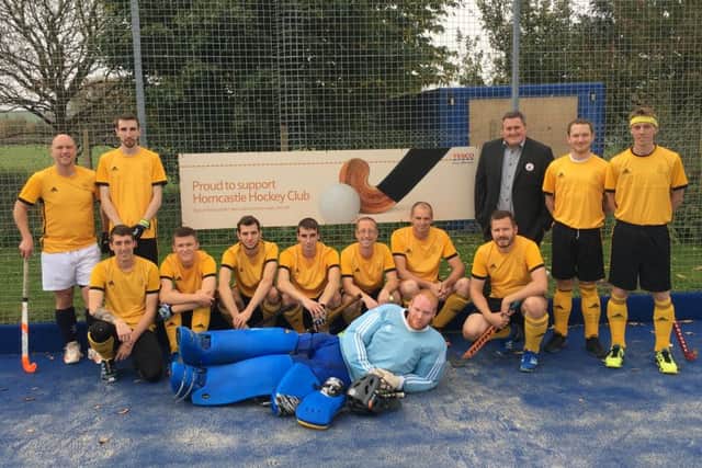 Horncastle Hockey Club men's first team with Luke McCluskey from Tesco who donated to the club's 'Pitch In' campaign for the resurfacing of the astroturf.