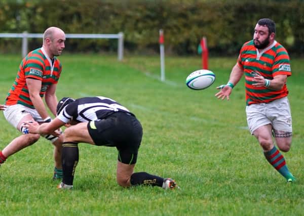 Dave Starling pops a pass out to Rasen try scorer Pete Southwell EMN-161031-123301002