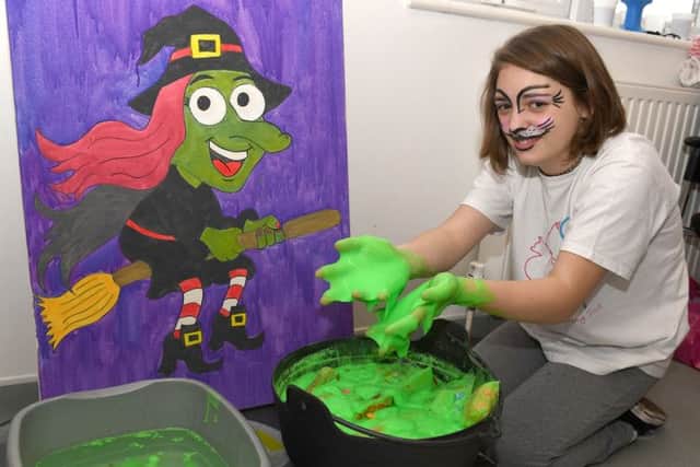 Sophie Healy, 13, attended the H.A.R.T fundraiser and bravely put her hands in the goo. EMN-160211-105437001