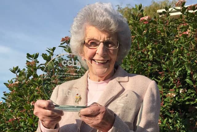 Coun Marion Brighton with her award. EMN-160311-091810001
