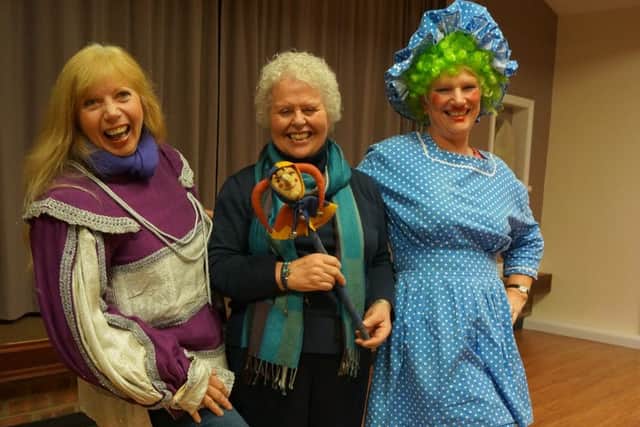 Patricia Ridger and Linda Cox get into the pantomime spirit with speaker Ruth Andrews EMN-160311-094410001
