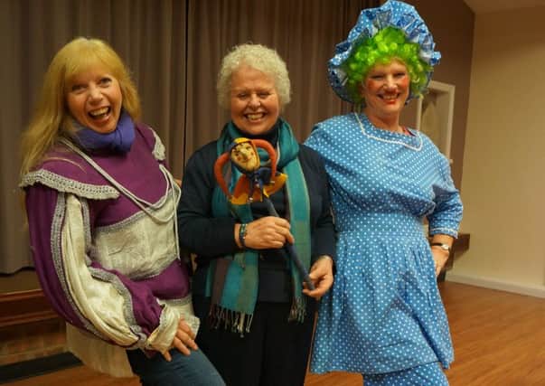 Patricia Ridger and Linda Cox get into the pantomime spirit with speaker Ruth Andrews EMN-160311-094410001