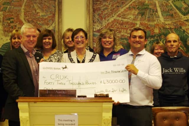 Louth Run for Life committee members have presented Cancer Research UK with a cheque for £43,000.