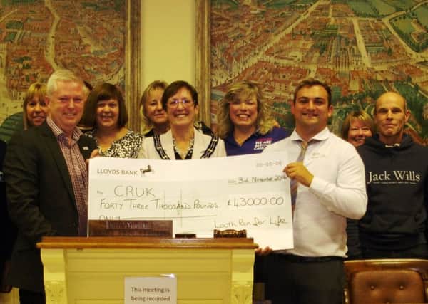 Louth Run for Life committee members have presented Cancer Research UK with a cheque for Â£43,000.