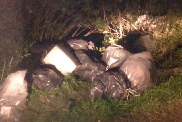 The fly tipped rubbish dumped on the Drove. EMN-160411-104613001