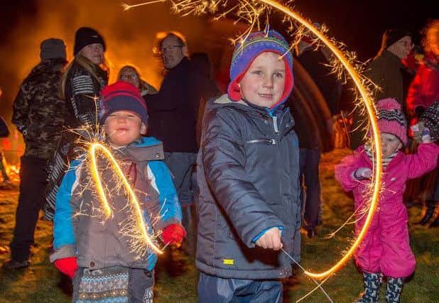 Lots of sparkle: George Carr (age 4) and Edward Ellershaw (age 4) enjoy the fun,at the Langton Hill event.