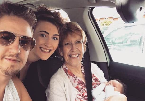 Abi pictured with her late mum Anne, brother Alex, and nephew Oakley.
