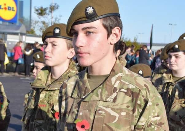 Henry Hyde with the Skegness detachment of the Army Cadets who took part in the town's Remembrance Day parade. Photo: Barry Robinson. ANL-161114-125952001
