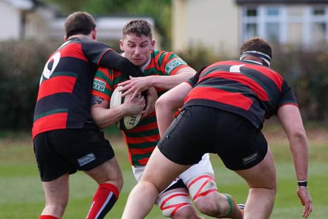 John Pilkington attenpts to punch a hole in Dronfield's defence EMN-160711-114103002