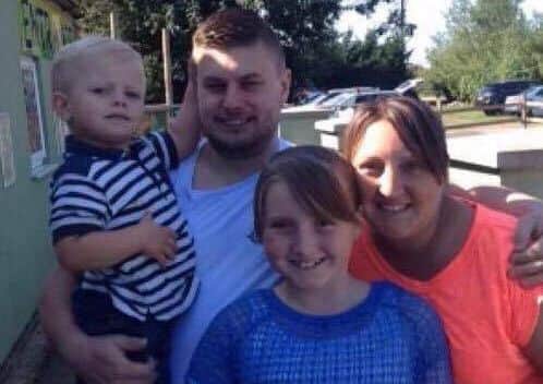 Terry Young with partner Natasha and children Charlie and Leah. Photo: supplied