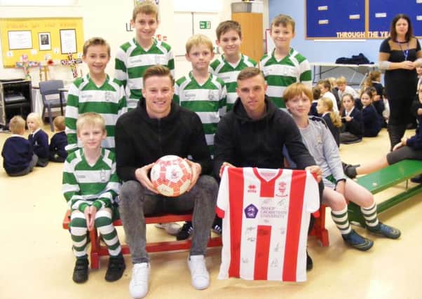 City stars Paul Farman and Jack Muldoon with Digby School players. EMN-161114-134005001