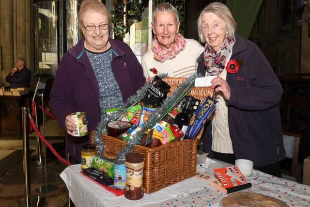 Winter Fayre at Sleaford parish church. L-R Angela Clash, Sue Parsons and Sheila Sheppard with Christmas hamper raffle prize. EMN-160711-093901001