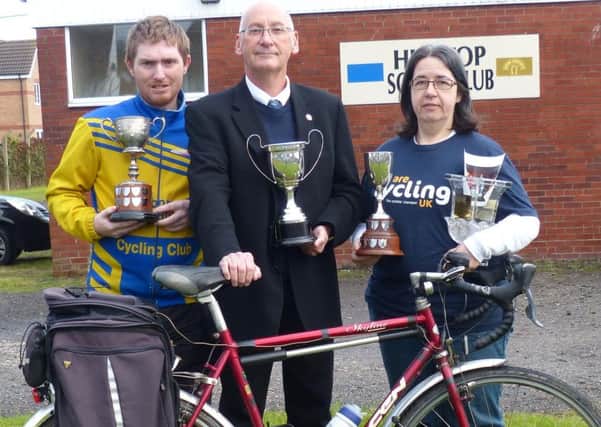 Louth Cyclings Tim Newbery (centre) holds the Paul Enderby Memorial Trophy, alongside Daniel Nicholson and Melanie Carroll EMN-161011-124437002