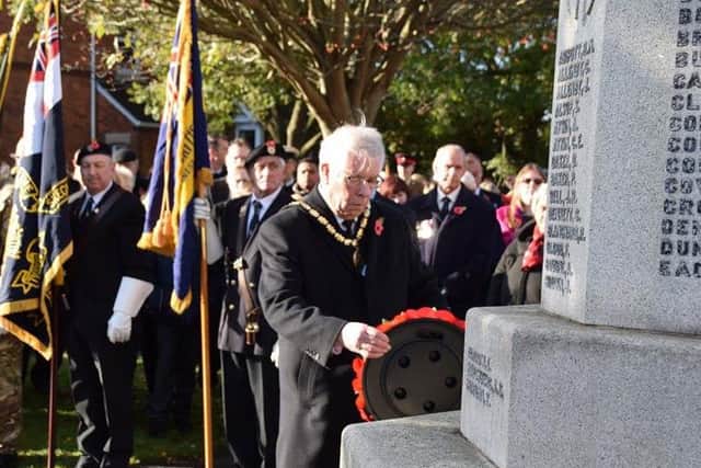 Mayor of Skegness Coun Dick Edginton laying a wreath at the memorial in Skegness. Photo: Barry Robinson. ANL-161114-110413001
