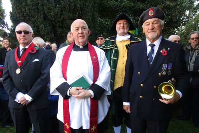 Pictured at the Burgh le Marsh war memorial to observe the two minutes silence are (from left) the deputy Mayor Dave Fenton, Father Terry, the Town Crier Steve  ODare and Bugler Eric Vaughan.  Missing from the photo is Royal British Legion representative Brian Bugg. (Photo: Eileen Chantry) ANL-161111-124147001