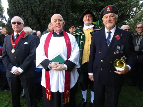 Pictured at the Burgh le Marsh war memorial to observe the two minutes silence are (from left) the deputy Mayor Dave Fenton, Father Terry, the Town Crier Steve  ODare and Bugler Eric Vaughan.  Missing from the photo is Royal British Legion representative Brian Bugg. (Photo: Eileen Chantry) ANL-161111-124147001