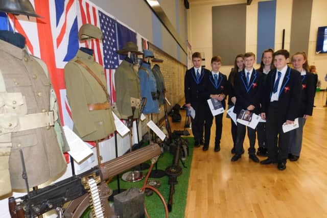 Members of St George's Remembrance Spearhead Group with a display of First World War artefacts brought in by collector and historian Mike Credland. EMN-161111-170657001
