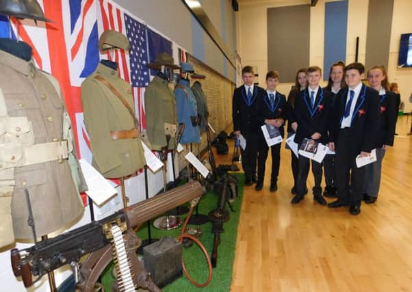 Members of St George's Remembrance Spearhead Group with a display of First World War artefacts brought in by collector and historian Mike Credland. EMN-161111-170657001