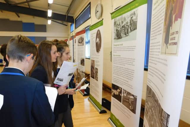 St George's pupils research the information displays brought in by the Lincolnshire Remembrance Project. EMN-161111-170636001