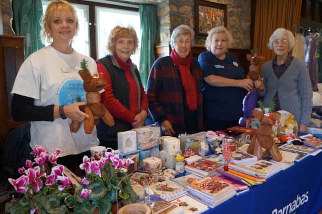 Members of Tealby WI, hospice representative Caroline Swindin and Tesco Community Champion Jenny Stimson EMN-161121-081914001
