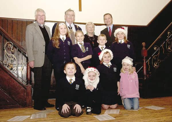 The Rev Bill Page, Mayor of Boston Maureen Baccas, MP Mark Simmonds, and school children at the Jalchatra Christmas Fair in November 2006.