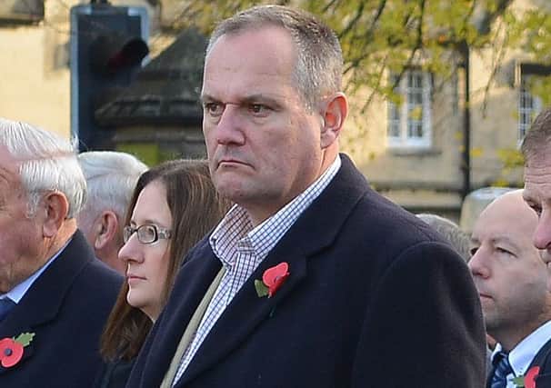 Mark Suffield (centre) at the Remembrance Sunday service. EMN-161114-162230001