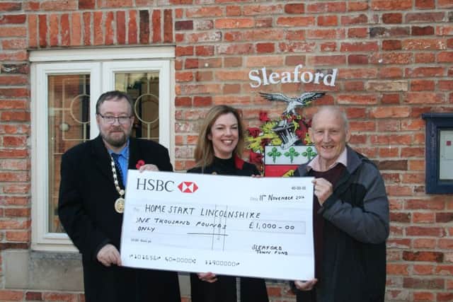 Making a Â£1,000 donation to Home-Start Lincolnshire are Coun David Suitor and Coun Grenville Jackson of Sleaford Town Council with Home-Starts Emma Haisman.