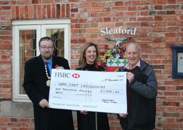 Making a Â£1,000 donation to Home-Start Lincolnshire are Coun David Suitor and Coun Grenville Jackson of Sleaford Town Council with Home-Starts Emma Haisman.