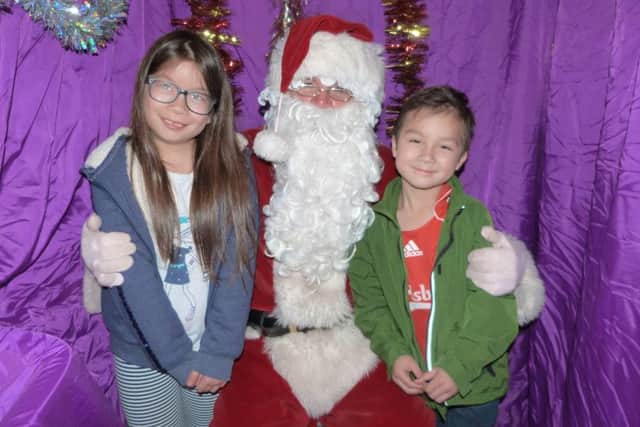 Anna and Leo Oxley visiting Santa at last year's Lions Victorian Fair. EMN-161117-070005001