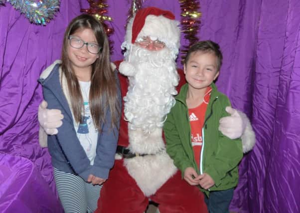 Anna and Leo Oxley visiting Santa at last year's Lions Victorian Fair. EMN-161117-070005001