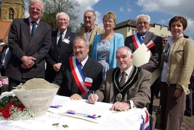 Town Mayors Michel Corbin and Brian Richardson signing the 20th anniversary Twinning Charter back in 2010.