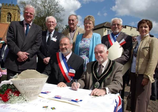 Town Mayors Michel Corbin and Brian Richardson signing the 20th anniversary Twinning Charter  back in 2010.