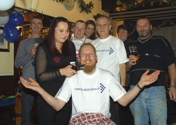 Burgh man Darrell Short parting with his beard in a fundraising shave for Cancer Research UK in January 2004.