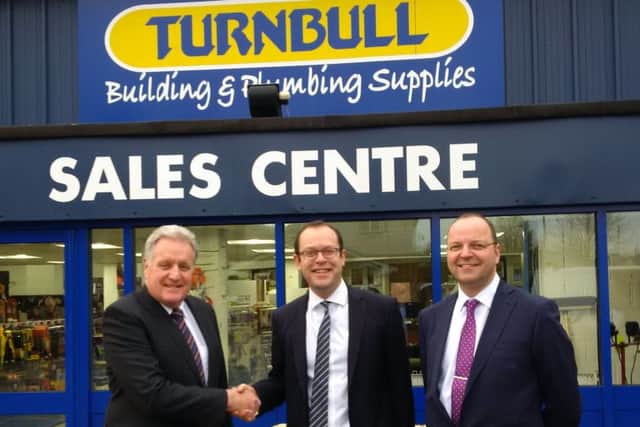 DEAL: From left, Gary Hopkins, managing director, Philip Carr, relationship director, HSBC, and Steve Vickers, finance director.