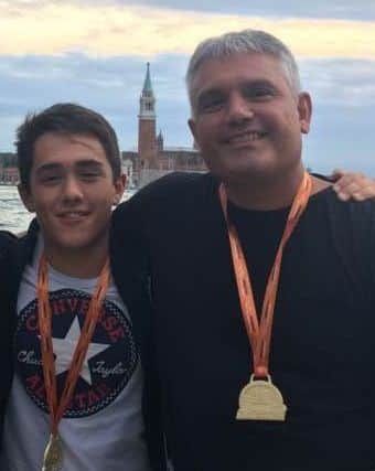 William and Dan Chico in the shadow of St Mark's Cathedral after completing the Venice Marathon.