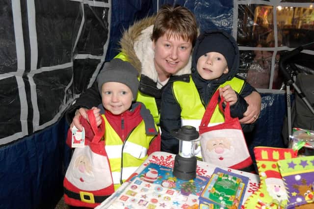 The Wright family wrapped up warm to have fun at the Spilsby Christmas lights switch-on. Friday. Pictured are (from left) Ruben , 4, mum Vicky  and Thomas, 7. Photo: MSKP-181116-7 ANL-161121-170800001