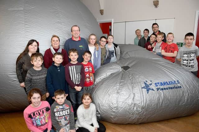 Starlincs Planetarium at Rainbow Flyers youth group at Ruskington, paid for by Second Chance charity shop. Youth group users with Molly Tarver - representing Second Chance charity shop, Karen Kenward and Mick Morton - owner of the planetarium. EMN-161124-155705001