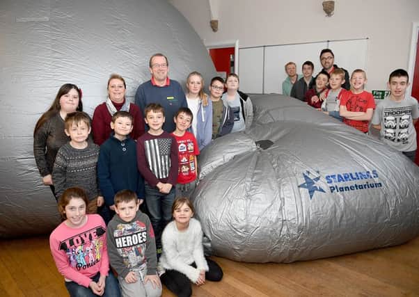 Starlincs Planetarium at Rainbow Flyers youth group at Ruskington, paid for by Second Chance charity shop. Youth group users with Molly Tarver - representing Second Chance charity shop, Karen Kenward and Mick Morton - owner of the planetarium. EMN-161124-155705001