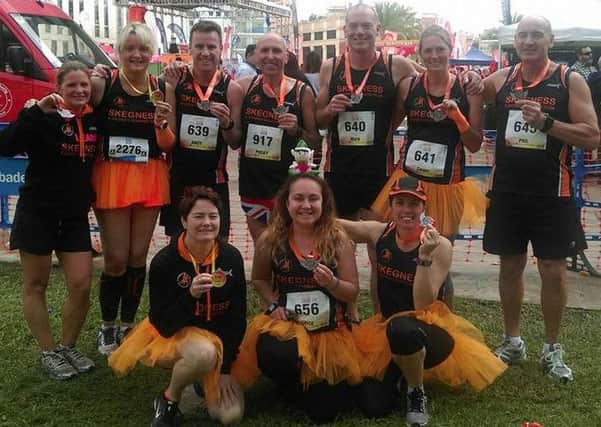 Skegness and District Runing Club at the Benidorm Half-marathon. Standing, from left, are Leanne Rickett, Helena Shelton, Andy Shelton, Pete Pocklington, Mark Lyon, Sarah Coupland, Phil Pickwell; kneeling, from left, Heather Baxter, Rebecca Grice and Emma Marshall-Telfer. EMN-161128-125351002