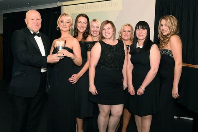 Keith Hussey, board member of Skegness, Partnership presents the Business of the Year award to Little Learners, who also won Best Care Provider. Photo: MSKP-181116-109 ANL-161125-122502001