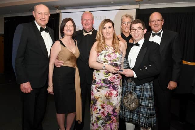 Richard Wood, branch director of MKM Building Supplies, presents the Retailer of the Year award to Kirks Butchers. Photo: MSKP-181116-87 ANL-161125-122315001