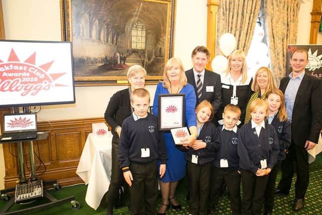 Breakfast Club Hero Rose Taylor, with staff and pupils from New Leake Primary School, Kellogg's Managing Director, David Lawlor, and MPs Kate Green and Matt Warman.