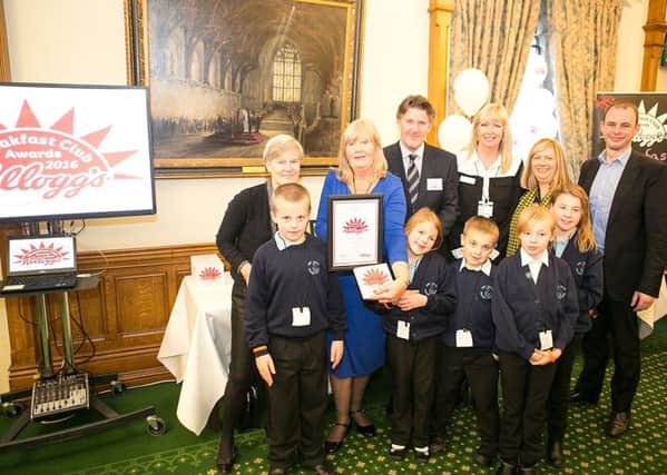 Breakfast Club Hero Rose Taylor, with staff and pupils from New Leake Primary School, Kellogg's Managing Director, David Lawlor, and MPs Kate Green and Matt Warman.