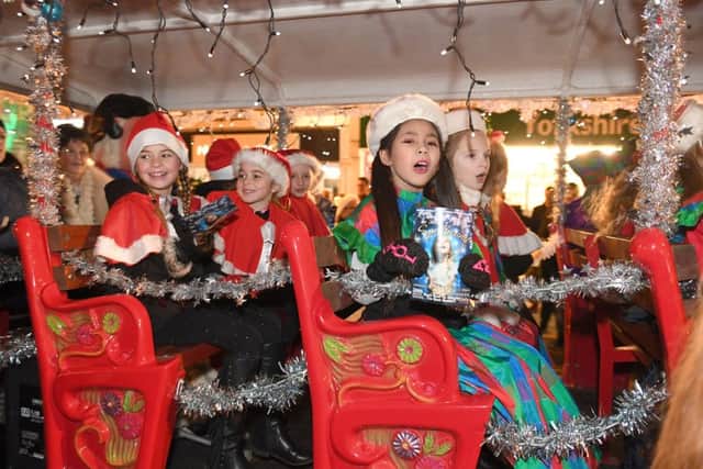 Dancers travelling in the  Skegness Christmas parade in the Butlin's land train. Photo: MSKP-241116-37 ANL-161125-154837001