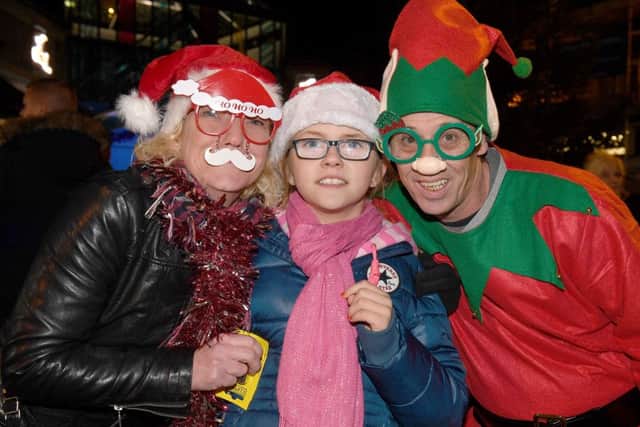 Skegness Christmas parade and lights switch-on.  From left,  Nicola Relph, Lily-Mai Paulson 9, Chris Childerley. Photo: MSKP-241116-2 ANL-161125-154913001