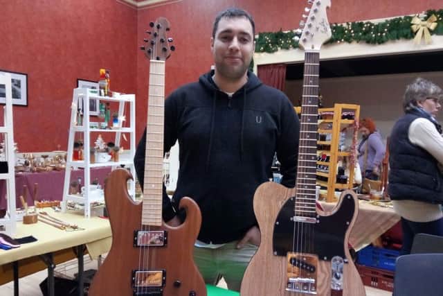 James Vines, of Louth, with his display of hand-made guitars from his business Baize Anthony Guitars. ANL-161126-163117001