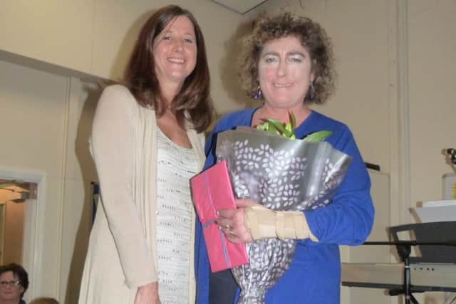 Anna Shepherd (left) presenting Angela Warmoth with flowers and gifts. (Lin) EMN-160112-153935001