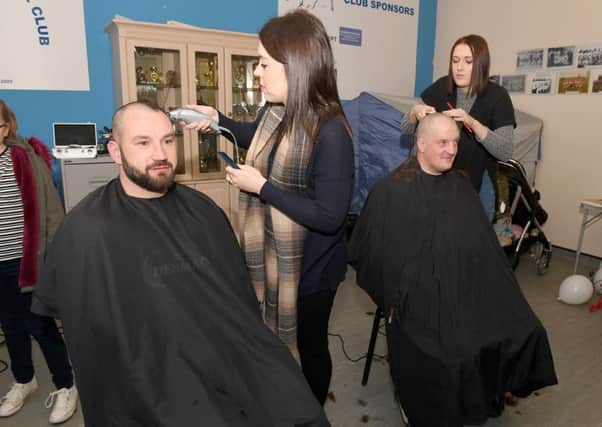 Swineshead Institute Football Club players Robbie Masters and Simon Prue having their heads shaved EMN-160612-101849001